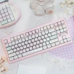 Exclusive Tokyo Pink Keycaps PBT dye-sub set, showcasing soft pastel pinks, intricate diary-inspired Japanese cityscape artwork from various premium angles.