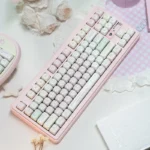 Close-up of Tokyo Pink Keycaps Urban Diary PBT Dye-Sub set, showcasing pastel pinks and stylized Tokyo cityscape details from an alternate angle.