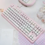 Exclusive Tokyo Pink Keycaps Urban Diary PBT Dye-Sub set, showcasing soft pastel pinks and charming diary-inspired Japanese art from a distinct angle.