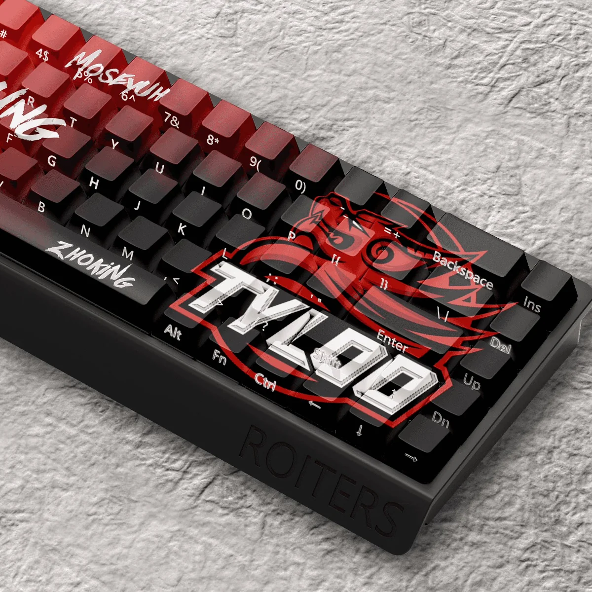 Premium TYLOO CS:GO PBT keycap set displayed from a dynamic angle, showcasing vibrant esports aesthetics and iconic branding for ultimate gaming.