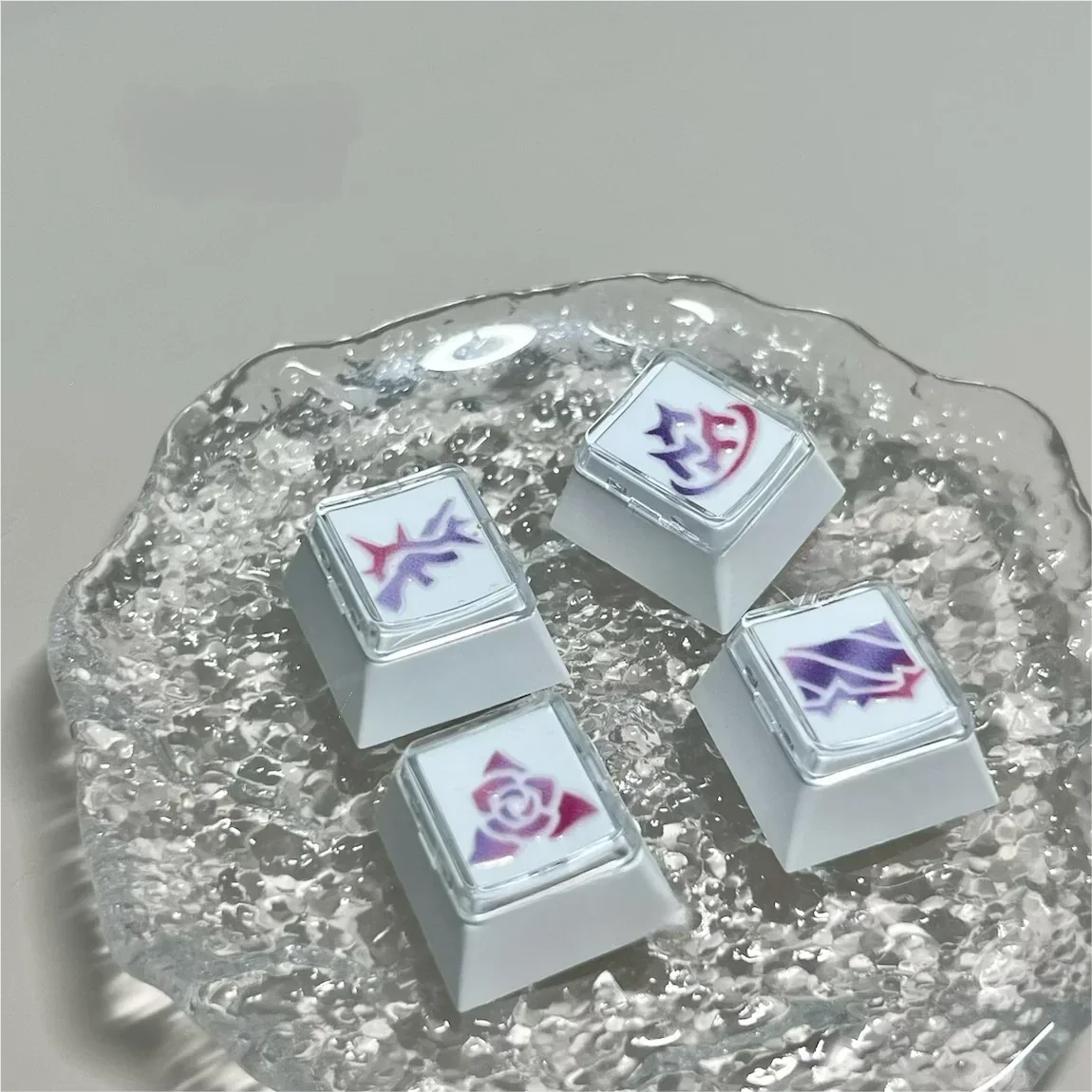 Vibrant, translucent artisan-handcrafted Valorant Vyse skill keycaps shown from various angles, highlighting detailed skill icons for a premium gaming design.