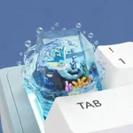 Close-up of a handcrafted Vaporeon Pokemon artisan keycap, showcasing its vibrant aquatic blue details and intricate sculpt from a unique angle.