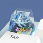 A detailed side view of the exclusive, handcrafted Vaporeon Pokemon artisan keycap, highlighting its vibrant aquatic blue sculpt and serene charm.