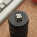 Precision CNC Vintage Gear Artisan Keycap viewed from multiple angles, highlighting its sophisticated textured linen-like finish and premium vintage industrial design.