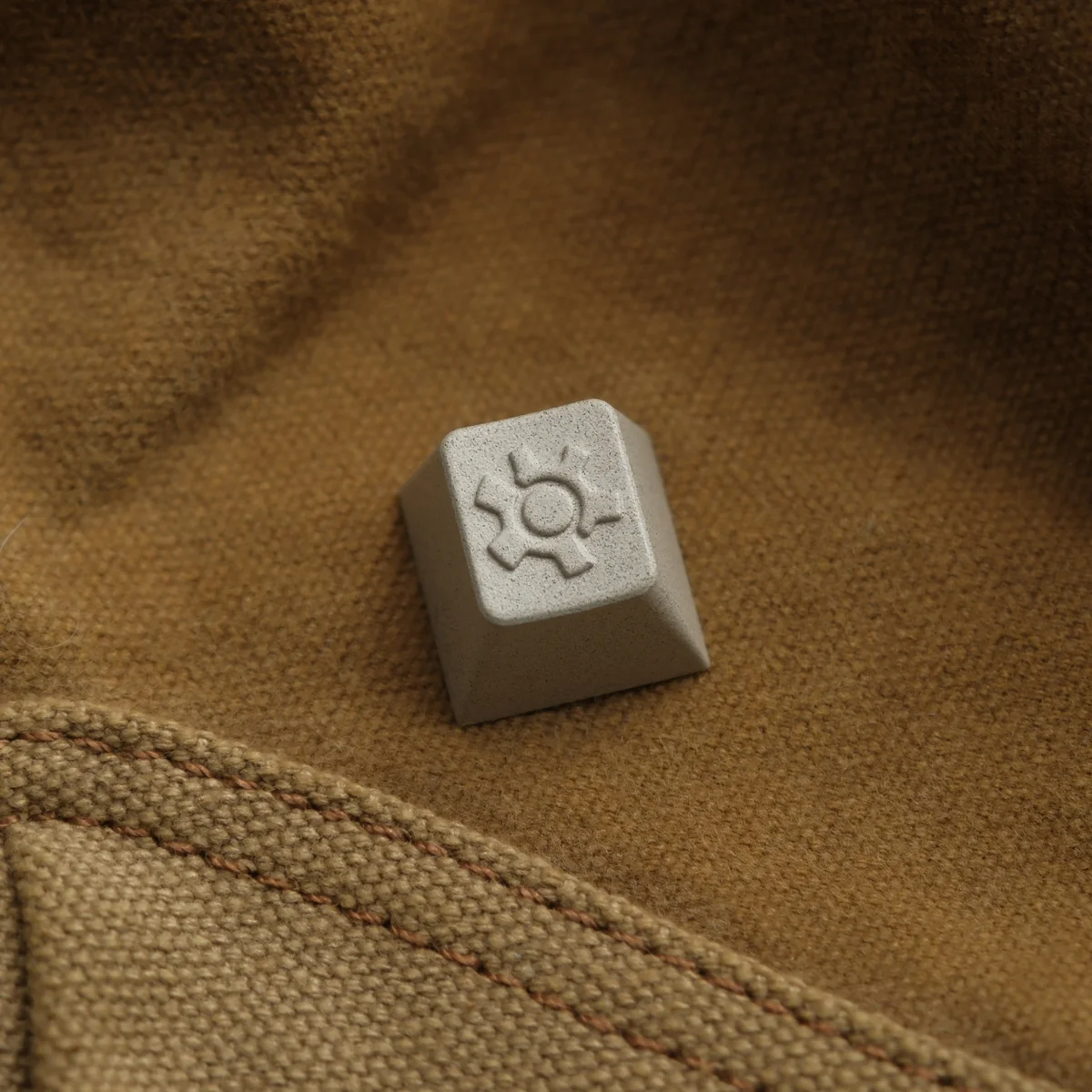 Premium precision CNC Vintage Gear Artisan Keycap for vintage industrial keyboards, showcasing a sophisticated textured linen-like finish.