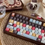 Distinctive Wacky Doll Artisan Keycap Set collection, viewed from multiple angles, highlighting its PBT dye-sub design and quirky, vibrant aesthetic.