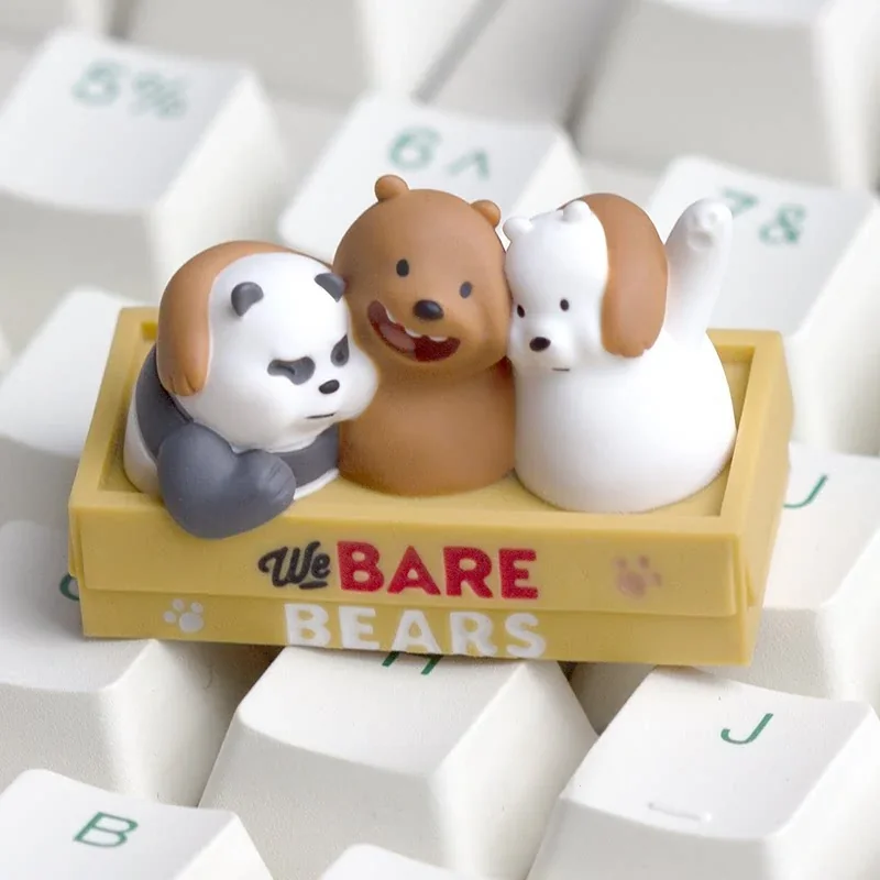 Detailed view of a handcrafted We Bare Bears artisan keycap, featuring Grizz, Panda, and Ice Bear in vivid resin, captured from various playful angle.