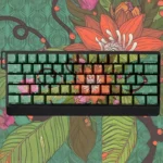 Wild Lotus PBT Keycap Set, durable and side-lit, showing its wild lotus motif from various angles for an artistic, serene keyboard.