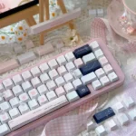 Wish Sticky Note Keycaps Set: Multiple views of unique PBT dye-sub keycaps. With playful doodles and pastel messages, perfect for keyboard dreams.