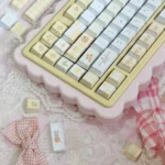 Experience the elegant Yellow Rose Garden PBT Cherry keycap set from every angle, featuring vibrant yellow roses and subtle green details on a clean design.