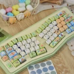 Adorable Zelda PBT dye-sub keycaps set, featuring vibrant chibi Link and friends, showcased from a dynamic angle, emphasizing the playful and heroic design.