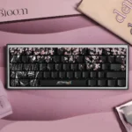 "Vibrant Zero Two PBT Dye-sub keycaps for DARLING in the FRANXX, showcasing iconic anime art and delicate sakura blossoms."