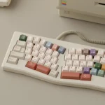 AIer PBT Keycaps Set showcasing a full set with playful AI and designer pixel art icons in vibrant colors, crafted from premium PBT for creative minds.