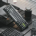 Eerie Alien Terror PBT keycap set glowing on a custom keyboard, showcasing its transparent, backlit design with sci-fi elegance.