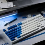 Amamiya Airline blue and white PBT aviation keycap set, beautifully displayed. Features serene sky and flight designs for an immersive, artistic expectation.
