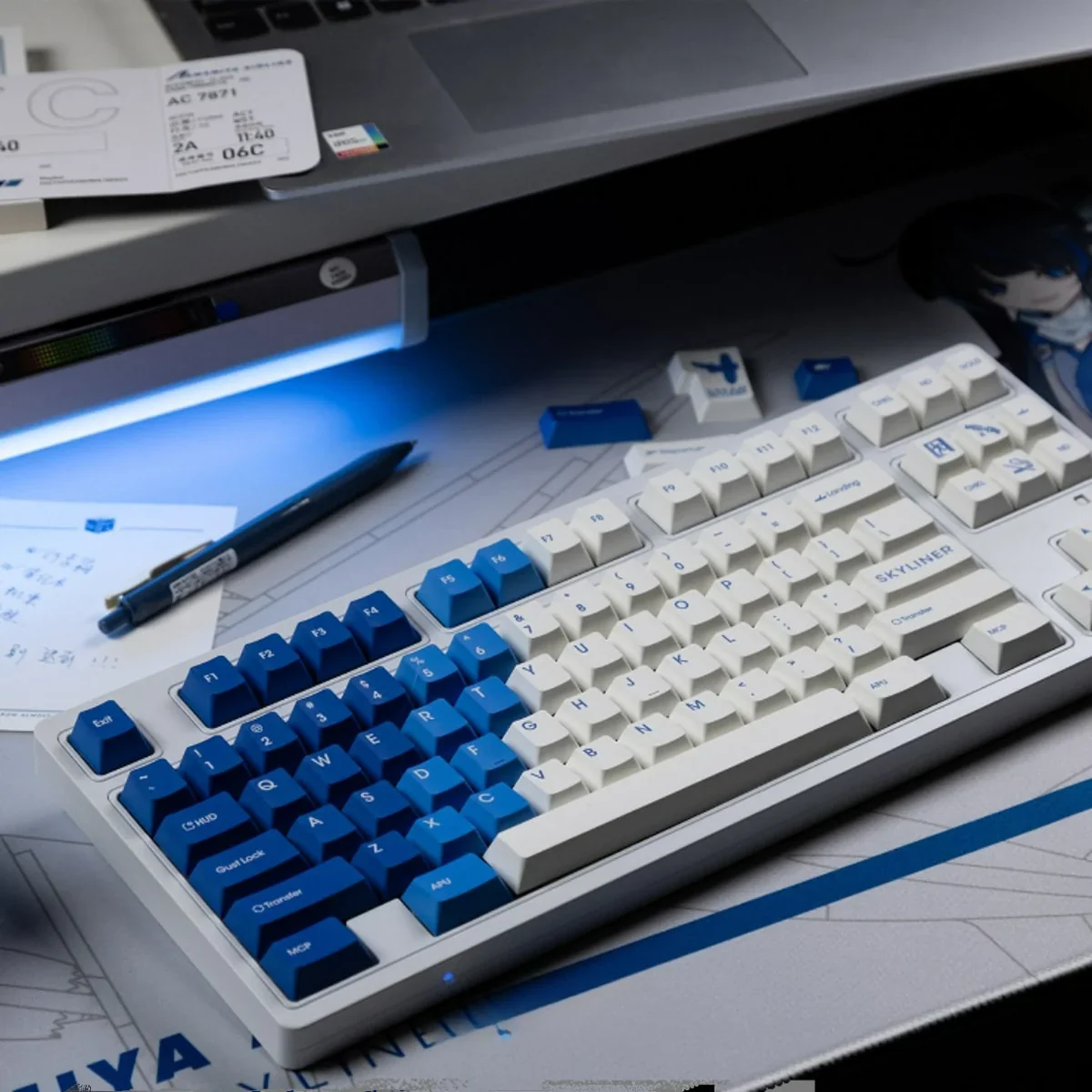 Amamiya Airline blue and white PBT aviation keycap set, beautifully displayed. Features serene sky and flight designs for an immersive, artistic expectation.
