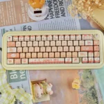 Whimsical Baking Cat Artisan Keycap Set showcasing an adorable cat baking with soft bread, a charming PBT MOA accent for keyboards.