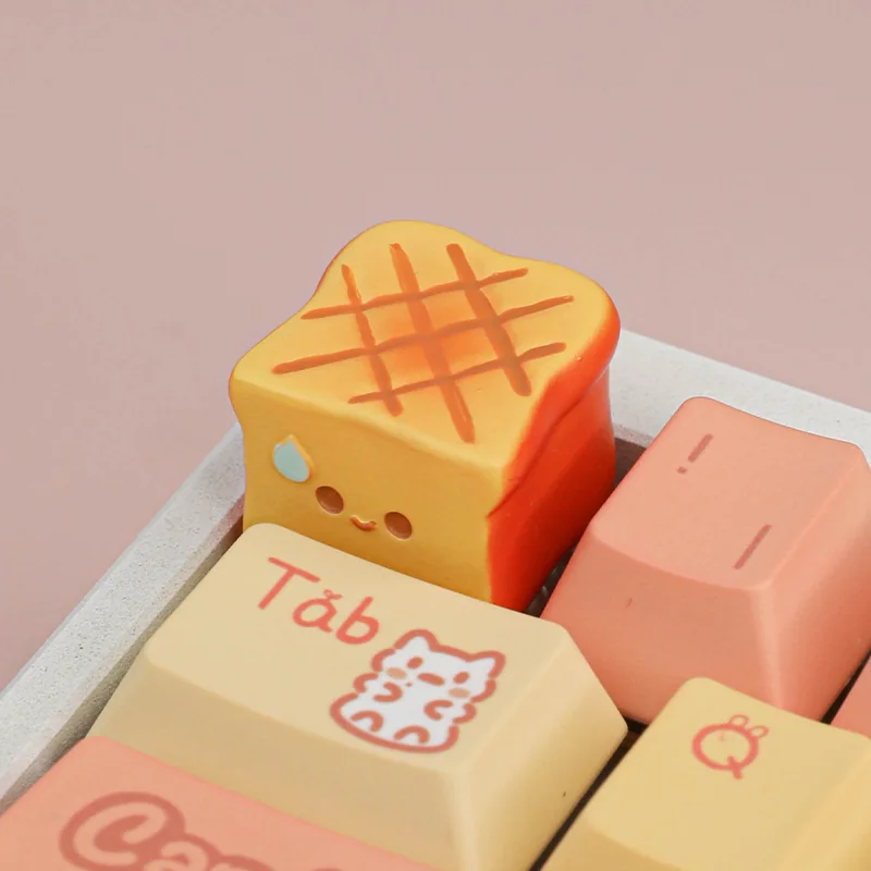 Detailed close-up of a whimsical handcrafted miniature roasted food artisan keycap, showcasing its intricate textures and warm, inviting culinary aesthetics.