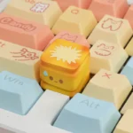 Close-up of a whimsical handcrafted miniature roasted artisan food keycap, showcasing its intricate details and warm culinary aesthetic.