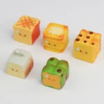 Side view of a delightfully detailed artisan keycap, featuring a miniature roasted food, highlighting its whimsical charm and craftsmanship.