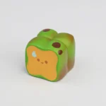 Whimsical artisan keycap featuring a miniature roasted food, meticulously handcrafted for a charming culinary aesthetics.