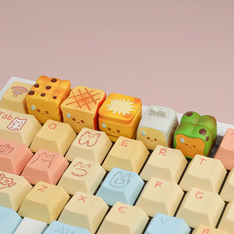 Close-up of whimsical handcrafted miniature roasted artisan food keycaps, showcasing intricate details and a warm culinary aestetics.