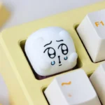 Whimsical Chimitan artisan resin keycap for ESC. Handcrafted, adorable, and expressive character shown from multiple angles. A unique, playful desk art.