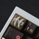 Handcrafted resin fish bone artisan keycap, artfully detailed from multiple angles, capturing its whimsical charm and vibrant aquatic aesthetic.