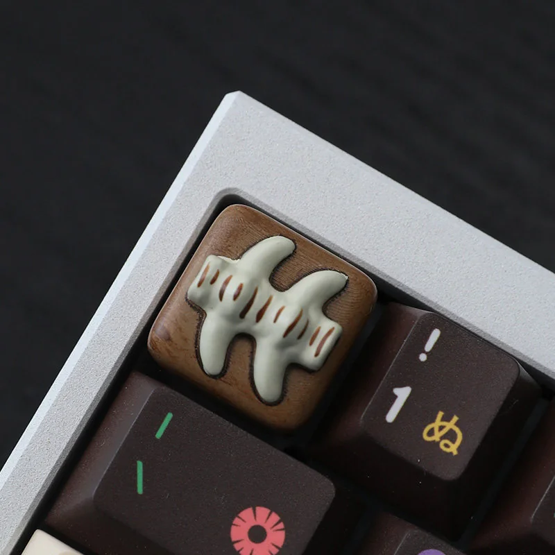 Handcrafted resin fish bone artisan keycap, artfully detailed from multiple angles, capturing its whimsical charm and vibrant aquatic aesthetic.