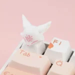 Frontal view of the unique handcrafted ESC artisan keycap, revealing a mythical fox gracefully nestled amidst delicate blossoms design.