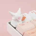 Handcrafted Mythical Fox & Blossom Artisan Resin Keycap. Translucent resin with delicate peach blossoms and a detailed mythical fox, evoking ancient design.
