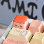 Handcrafted whimsical strawberry pudding artisan keycap for ESC, an adorable miniature dessert with vibrant details for charming keyboard personalization.