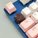 Handcrafted artisan resin keycap in a rich chocolate shell pattern, capturing a delectable gourmet dessert aesthetic.
