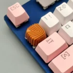 Exquisite handcrafted artisan resin keycap featuring a rich caramel shell pattern, reminiscent of a gourmet chocolate dessert.