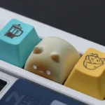 Charming Wangzai Cat & Takoyaki artisan resin keycap, a detailed miniature sculpture showcasing its unique playful design from various perspectives.