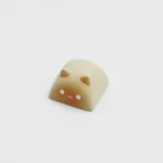 Detailed side view of the handcrafted Wangzai Cat and Takoyaki artisan resin keycap, highlighting its vibrant colors and unique playful design.