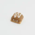 Charming artisan resin keycap featuring a detailed miniature takoyaki, showcasing vibrant colors and a playful design. Perfect for custom keyboards.