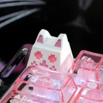 Artisan whimsical cat keycap for ESC, showcasing its translucent design with magical hues from multiple angles, perfect for RGB keyboard.