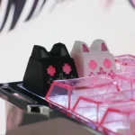 Artisan whimsical translucent cat keycap for ESC, showcasing its magical hues from various angles, perfect for RGB keyboards.