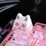 Artistic collection of whimsical translucent cat ESC keycaps, viewed from multiple angles, highlighting their magical glow for RGB keyboard.