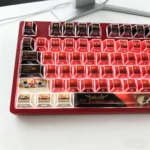 An artistic display of the Asuka EVA faceted PBT side-engraved backlit keycaps set from various angles, emphasizing their sharp lines and illuminated legends.