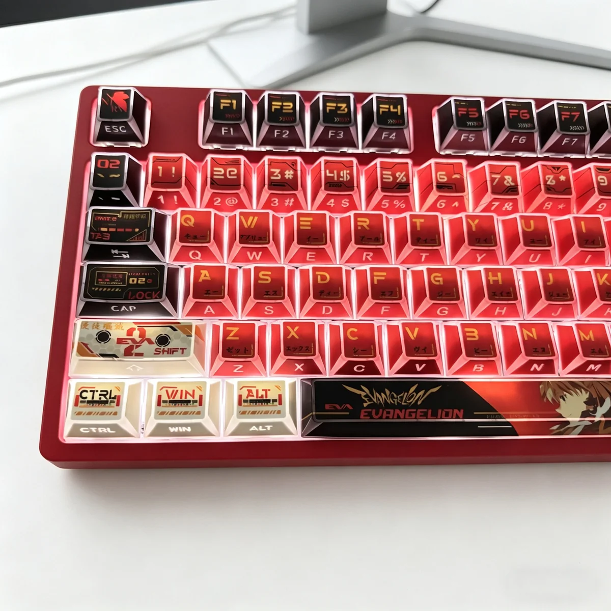An artistic display of the Asuka EVA faceted PBT side-engraved backlit keycaps set from various angles, emphasizing their sharp lines and illuminated legends.