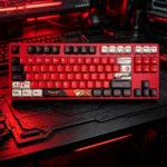 A collection of Asuka EVA faceted PBT keycaps set, side-engraved and backlit, shown from multiple dynamic angles to highlight their sharp, artistic design.