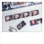 Vibrant Azur Lane Cheshire PBT keycap set gaming masterpiece, showcasing detailed anime art and durable PBT material from multiple angles.
