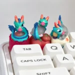 Close-up of a handcrafted 3D translucent resin Azure Dragon artisan keycap, highlighting its intricate scales and glowing mystical aesthetic from a unique design.