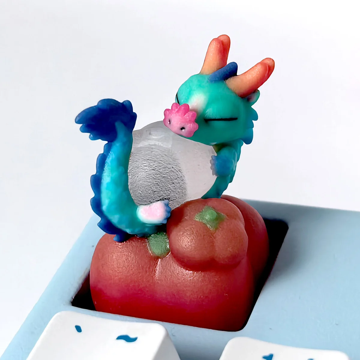 Close-up view of a handcrafted 3D translucent resin Azure Dragon artisan keycap, showcasing its intricate scales and glowing mystical aura from a unique angle.