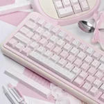 A detailed perspective of the Elegant Ballet Poetry PBT Dye-Sublimated Keycap Set, showcasing its soft pastel hues and intricate ballet motifs.