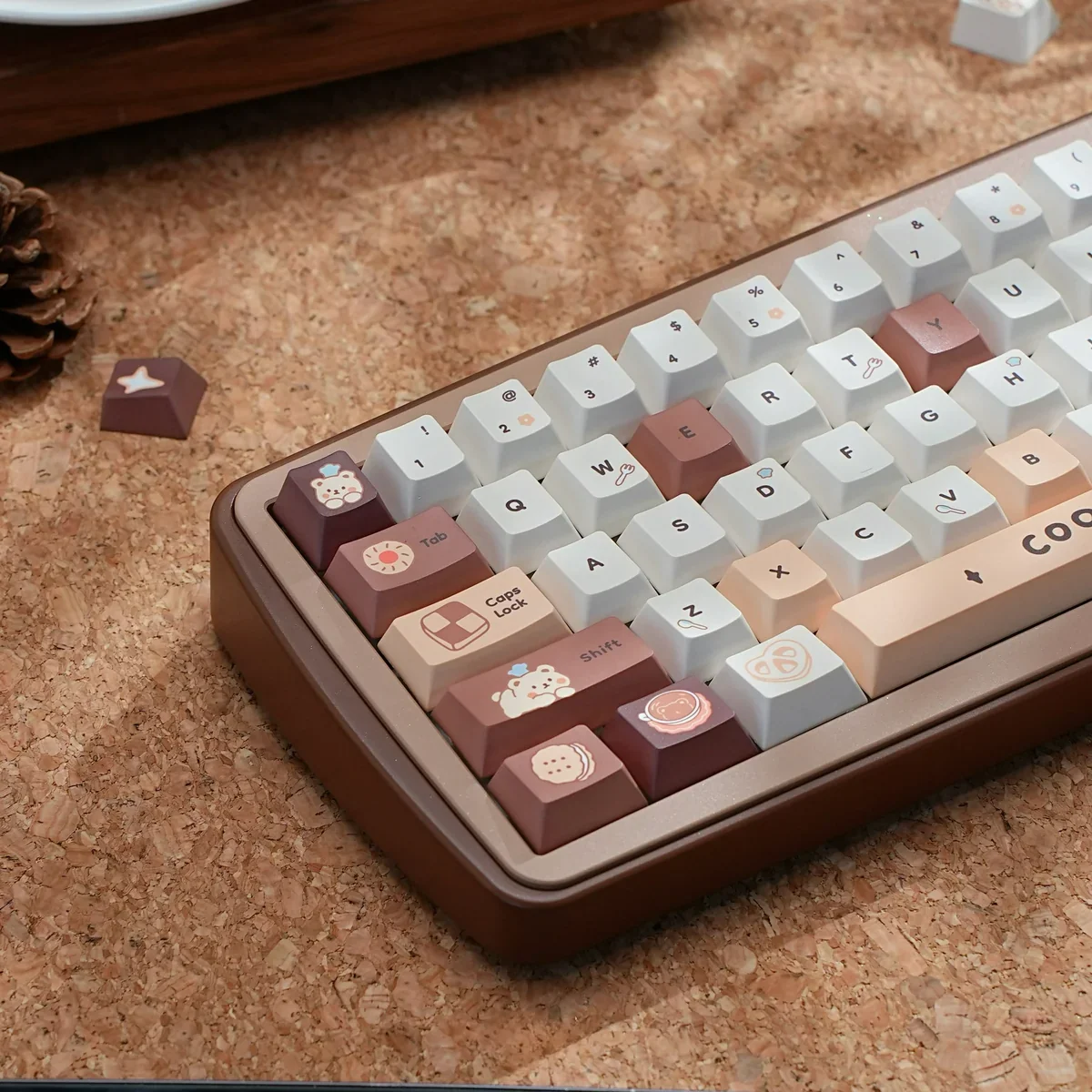 Close-up of the Whimsical Bear Bakery PBT Keycap Set, featuring adorable bear and pastry designs in warm pastel colors from multiple playful angles.