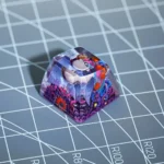 Exclusive Binding of Isaac SA R1 keycap. Iconic Isaac character art, vibrant game colors, and classic SA R1 profile are showcased from multiple artistic design.