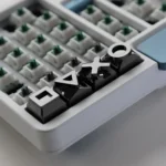 A collection of Black Piano Gaming Console Button Keycaps for a gaming console set, showcasing their sleek finish and industrial durability from various angles.